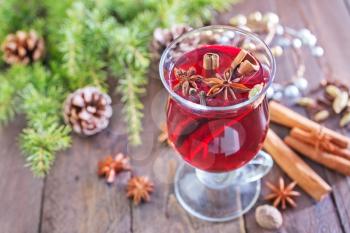fresh mulled wine in the glass and on a table