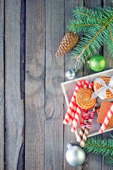 christmas background, christmas cookies and decoration on wooden boards