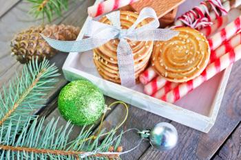 christmas background, christmas cookies and decoration on wooden boards