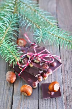 chocolate with nut and christmas tree on a table