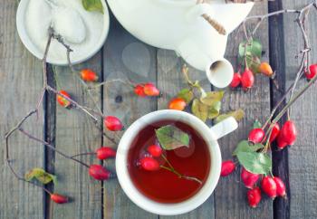 fresh tea with rosehip on a table