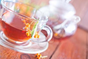 tea in glass cup on the wooden table