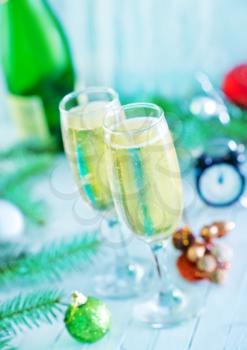 two shampagne glasses and decoration for christmas tree