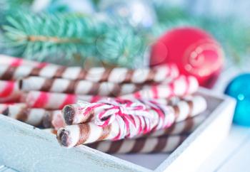 Christmas candy, Christmas treats and a branch of the Christmas tree