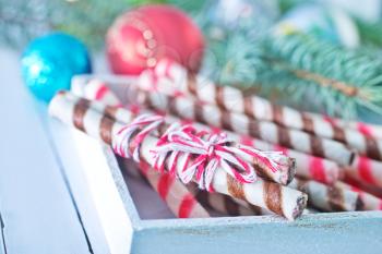 Christmas candy, Christmas treats and a branch of the Christmas tree