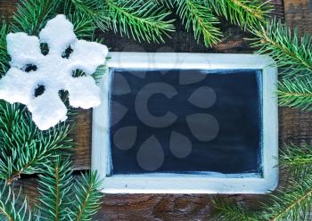 christmas background, snowflakes on the wooden background