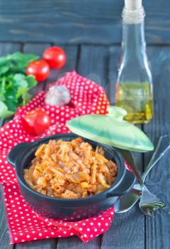 braised cabbage in bowl and on a table