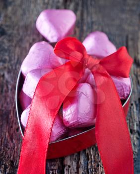 red hearts and chocolate candy on a table