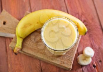 banana yogurt in glass and on a table