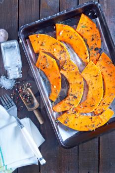 pumpkin pieces with aroma spice on a table