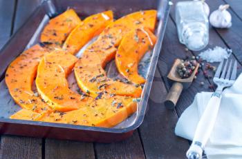 pumpkin pieces with aroma spice on a table