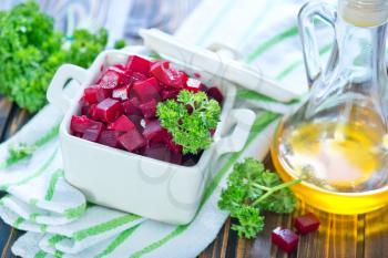  beet salad in bowl and on a table