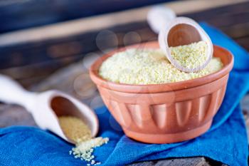 cous-cous in bowl and on a table