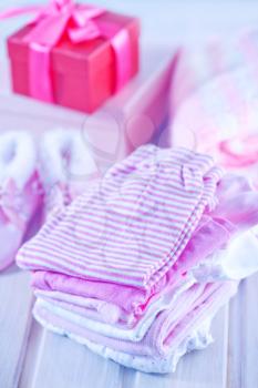 baby clothes for girl on a table