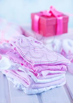 baby clothes for girl on a table