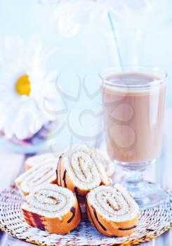 sweet cake on plate and on a table