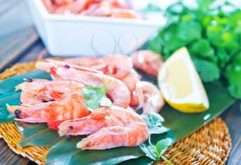 shrimps and lemon on the wooden table