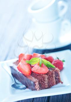 chocolate cake with strawberry on plate