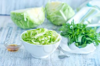 cabbage salad in bowl and on a table