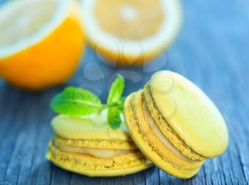 lemon macaroons and mint leaf on a table