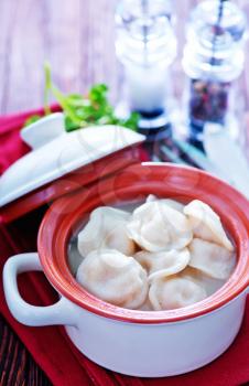 boiled pelmeni with butter in the bowl