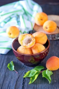 apricot in bowl and on a table