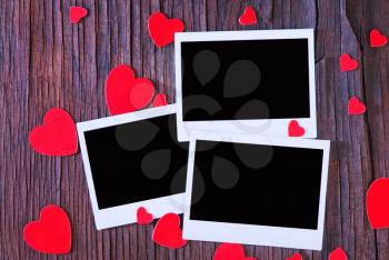 paper heart and photo on the wooden background