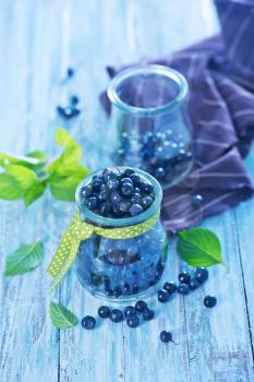 fresh blueberry in glass and on a table