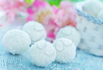 sweet coconut balls on the wooden table
