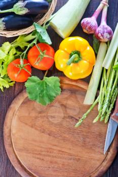 fresh vegetables on the wooden kitchen table