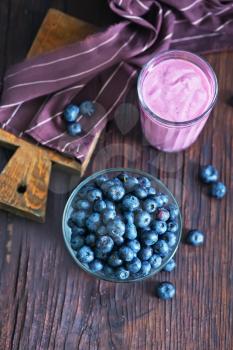 yogurt with blueberry on the wooden table