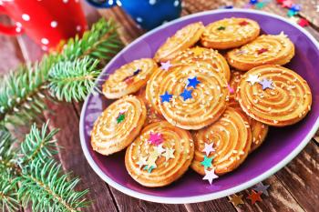 christmas cookies on plate and on a table