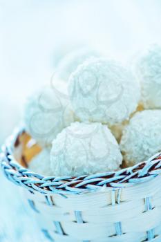coconut balls in basket and on a table