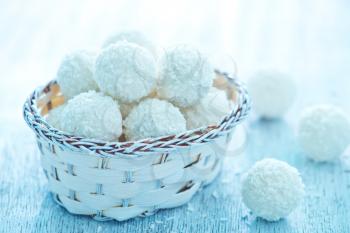 coconut balls in basket and on a table