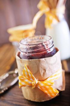 jam in glass jar and on a table