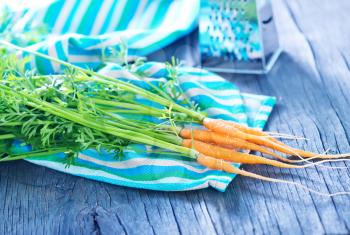 fresh carrot on napkin and on a table