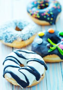 donuts on plate and on a table