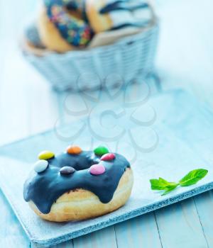 donuts on plate and on a table