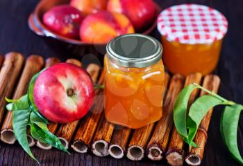 nectarine jam in bank and on a table