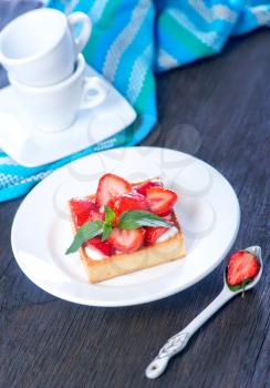 cake with strawberry on the white plate