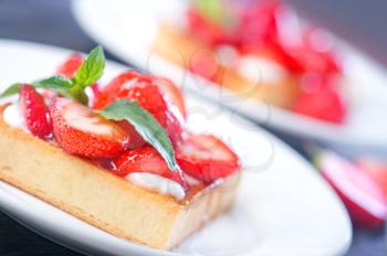 cake with strawberry on the white plate