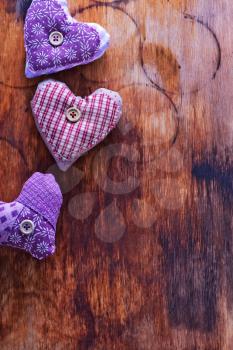 Love hearts on vintage wood, violet hearts