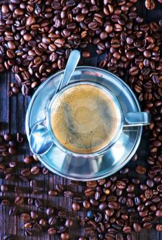 hot coffee in metal cup and on a table