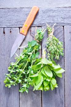 fresh aroma herbs on the wooden table