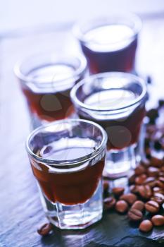 coffee liquor into small glasses and on a table