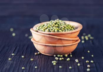 raw mung in bowl and on a table