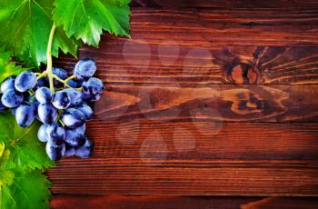 fresh grape on the wooden table, grape on a table