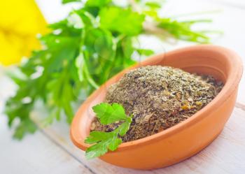 Dry parsley in the bowl, green parsley