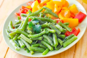 Fresh raw vegetables in the green plate
