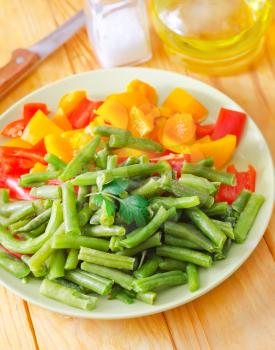 Fresh raw vegetables in the green plate